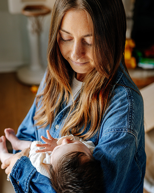 A parent holding a newborn